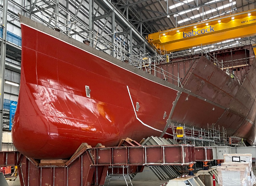 Gleaming in its red paint and complete, this is the bright, bulbous bow of HMS Venturer, the first of the Royal Navy’s new Type 31 frigates.