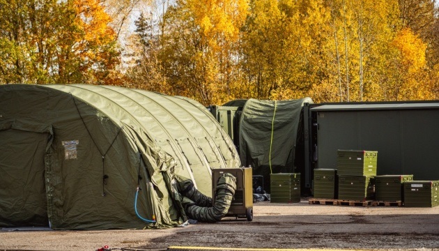 The Estonian Centre for Defence Investments (ECDI) announces the dispatch of a fourth field hospital to Ukraine, in a joint effort with Iceland, to aid Ukraine in Russia’s aggression war. This contribution is further bolstered by Germany’s donation of twelve trucks and ten trailers, specifically for the transport of the hospital.