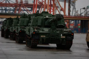 On 17 January, hundreds of U.S. Army personnel, federal civilian employees, contractors, and transportation staff worked through the night at the Port of Gdynia, Poland, to offload approximately 250 pieces of military equipment. The operation included howitzers, Humvees, and M1 Abrams tanks, delivered by the Logistics Naval Vessel Cape Texas as part of the Reception, Staging, and Onward Movement (RSOM) mission.