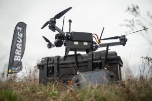 The Ukrainian defence technology cluster Brave1 has tested fourteen FPV bomber drones, ranging from 10 to 18 inches, for their resistance to electronic warfare (EW), payload capacity, flight range, and combat usability. The mission required each drone to fly 10 kilometres under EW interference, drop a munition on target, and return to base, with several successfully completing the task.