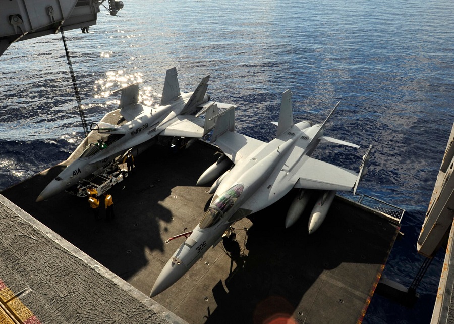 U.S. Navy fighter jet and tow vehicle plunge off USS Harry S. Truman into Red Sea during onboard mishap