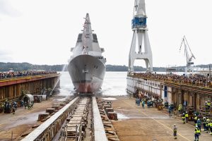 Navantia today launched the F111 “Bonifaz” frigate, the first ship of the F-110 programme for the Spanish Navy, in a ceremony held at its shipyard in Ferrol (A Coruña). The event was attended by Prime Minister Pedro Sánchez and Her Majesty Queen Sofía, who sponsored the vessel by breaking a bottle against its hull before it slid into the estuary.