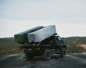Kongsberg and Thales announced the successful live-firing of a Naval Strike Missile (NSM) test munition from the StrikeMaster missile launch vehicle in Norway, demonstrating the suitability of Thales Australia’s Bushmaster Utility variant as a launch platform for Kongsberg’s NSM. The test used a blast test vehicle to confirm the safe launch of the NSM and underlines StrikeMaster as a low-risk solution to meet Australia’s long range strike requirements.