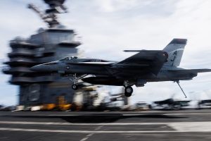 President Donald Trump has assembled what he called a “massive armada” of U.S. warships and aircraft near Iran, a posture that mirrors a recent military buildup in the Caribbean as he considers authorizing strikes. The deployment has expanded with the arrival of the USS Abraham Lincoln and its carrier strike group in the U.S. Central Command area, adding destroyers and broadening both offensive and defensive options.