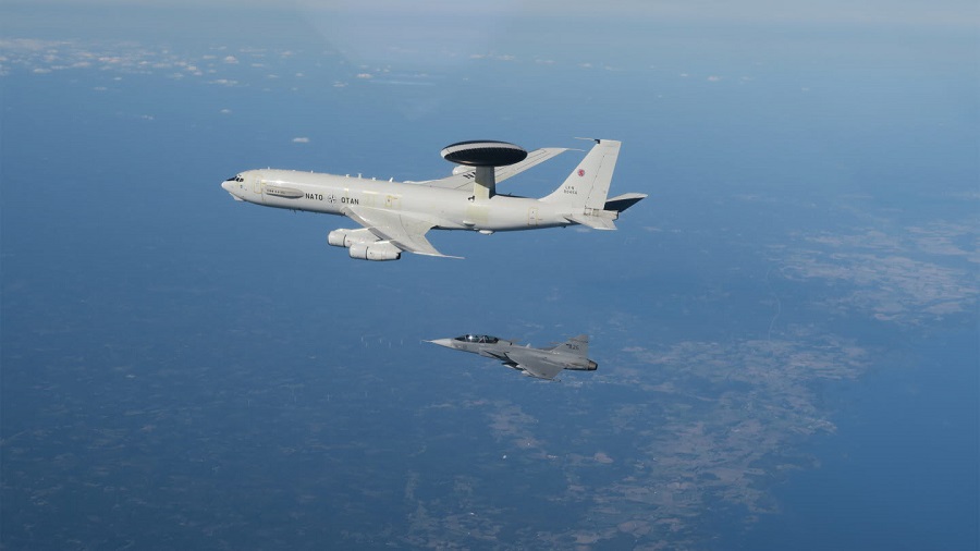 Swedish Air Force Gripen fighters fly with NATO AWACS