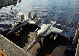 U.S. Navy fighter jet and tow vehicle plunge off USS Harry S. Truman into Red Sea during onboard mishap