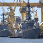 HII is targeting a 15% increase in shipyard throughput in 2026, building on 14% growth last year as it seeks to deliver warships faster to the U.S. Navy. America’s largest shipbuilder has approximately 40 ships in active construction or modernization at its Ingalls and Newport News shipyards.