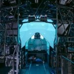 Lockheed Martin connected 16 F-35 full mission simulators across four bases for a two-hour distributed mission rehearsal. F-18 simulators and an E-2D Hawkeye controller joined the event from a fifth location.