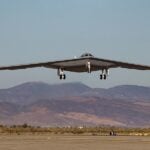 New footage appears to show a B-21 Raider test aircraft reportedly known as “Cerberus” departing Edwards Air Force Base and flying over California’s Mojave Desert. The flight comes as Northrop Grumman expands testing with multiple aircraft and increases production of the new strategic bomber.