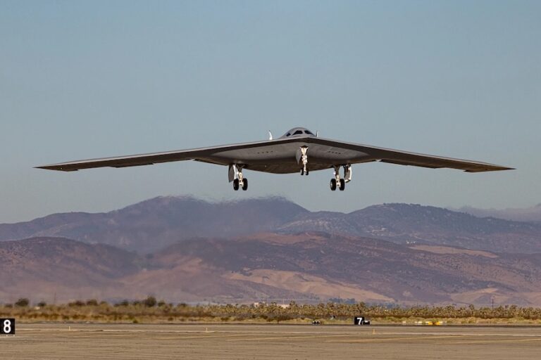 New footage appears to show a B-21 Raider test aircraft reportedly known as “Cerberus” departing Edwards Air Force Base and flying over California’s Mojave Desert. The flight comes as Northrop Grumman expands testing with multiple aircraft and increases production of the new strategic bomber.