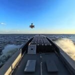 Ukraine has integrated a vertical-launch system for aerial interceptor drones aboard a Magura unmanned surface vessel, expanding the platform from naval strike missions into mobile air defense. The configuration is intended primarily to counter Russian Shahed-type attack drones over coastal areas and the Black Sea.