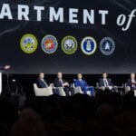 The Pentagon plans to field hundreds of thousands of one-way attack systems this year, followed by millions in coming years, Secretary of War Pete Hegseth said at AUSA 2026. Project Agincourt will prepare the command structure for that expansion, laying the groundwork for a four-star-led Autonomous Warfare Command.