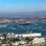 USS Abraham Lincoln’s commanding officer and strike group commander addressed concerns about crew conditions and combat logistics after the carrier’s record-setting, 322-day deployment. They spoke at a press conference shortly after the ship arrived at Naval Air Station North Island, California.
