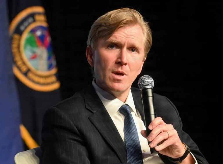 The United States has reduced the number of brigade combat teams assigned or allocated to Europe from five to three and is reviewing its military presence across the continent, Under Secretary of War for Policy Elbridge Colby said. Washington is asking European allies to lead conventional defense while prioritizing deterrence against China and retaining options for military action in the Middle East.